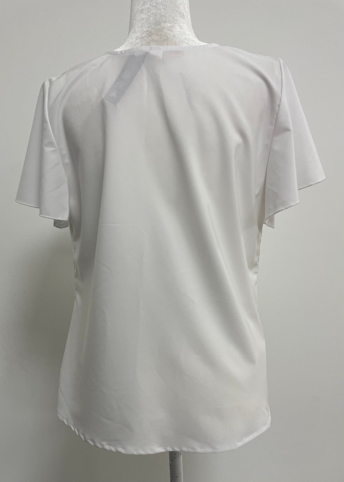 BLUSA BLANCA HUEQUITOS